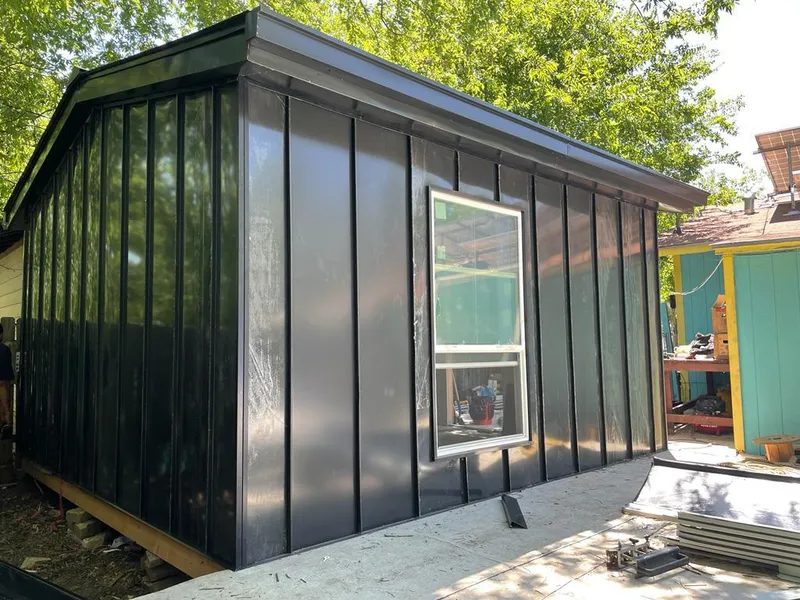Black standing seam metal wall panels for Roof Inspection in Opelousas