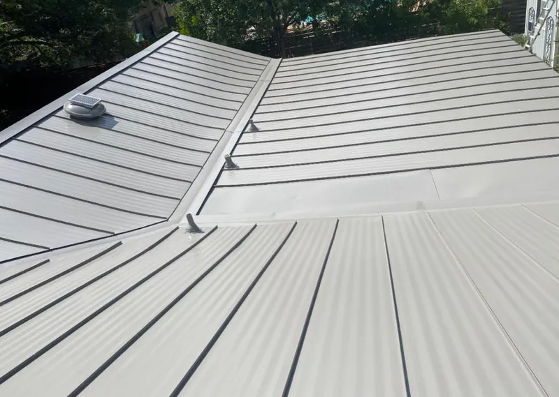 Solar attic fan installed on a metal roof for Roof Ventilation in Opelousas